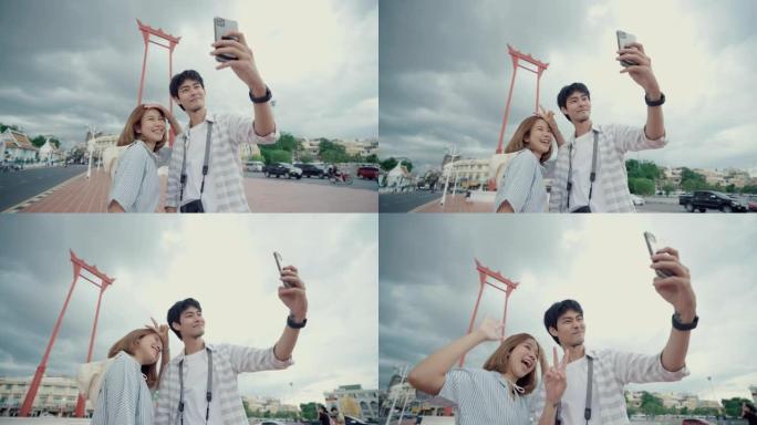 年轻夫妇在曼谷的城市景观中自拍