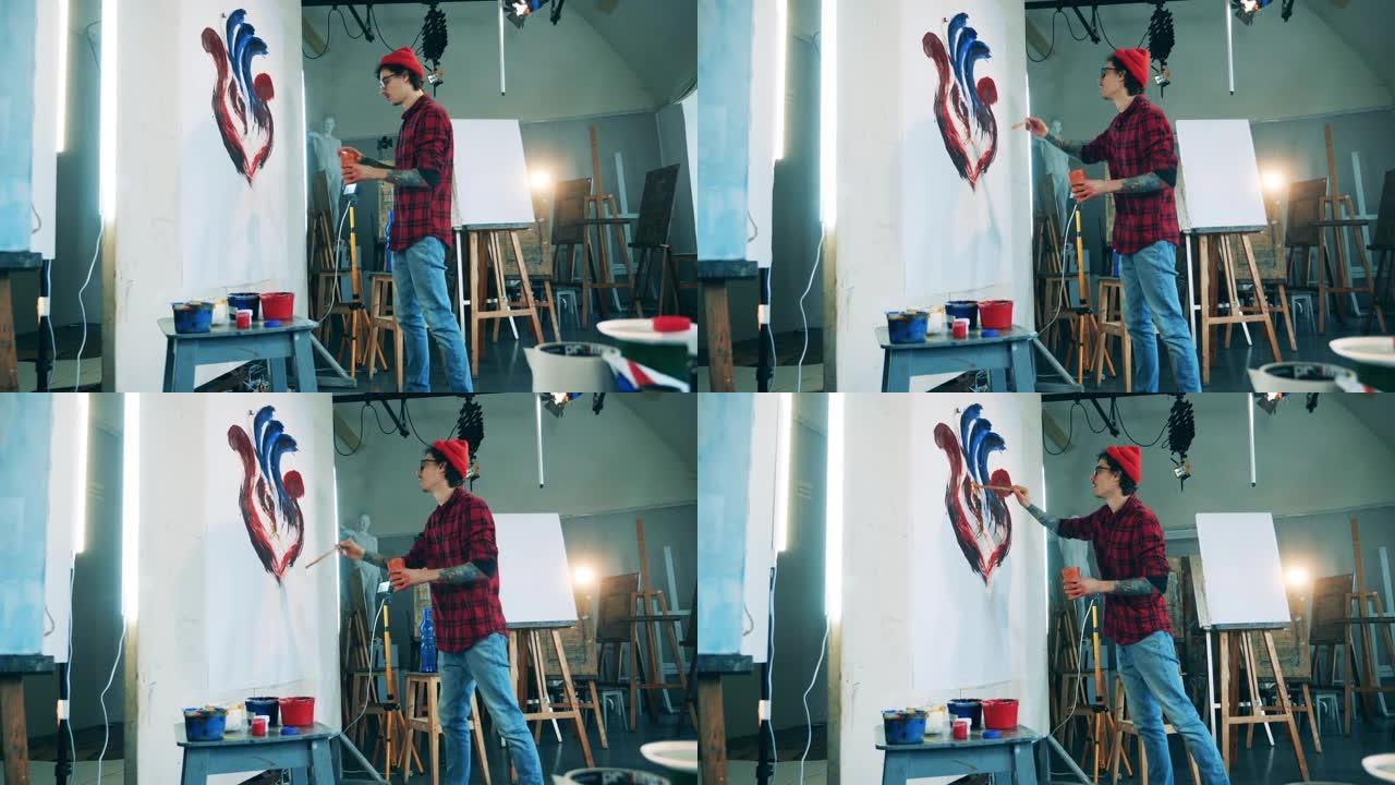 男艺术家正在他的工作室创作一幅画