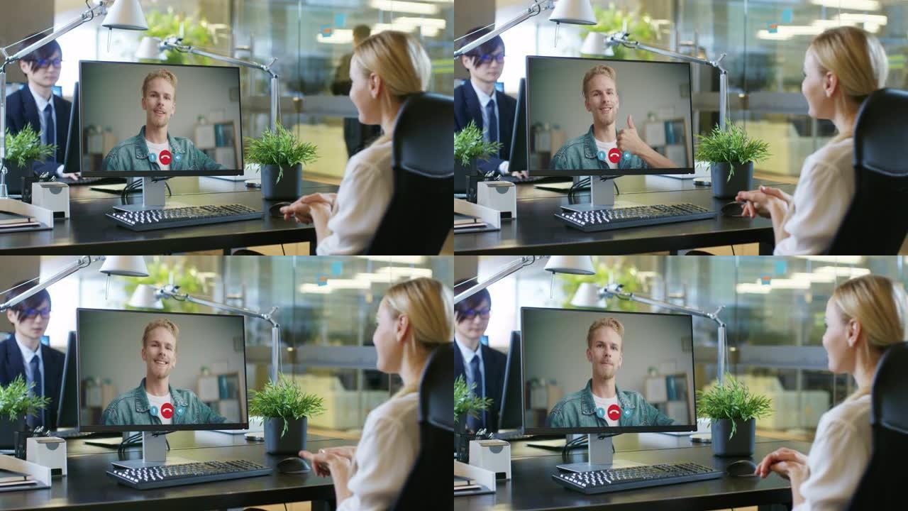 现代办公室，女商人使用计算机通信通过通信视频电话与她的年轻同事在家或客户工作。安全电子商务，电子商务