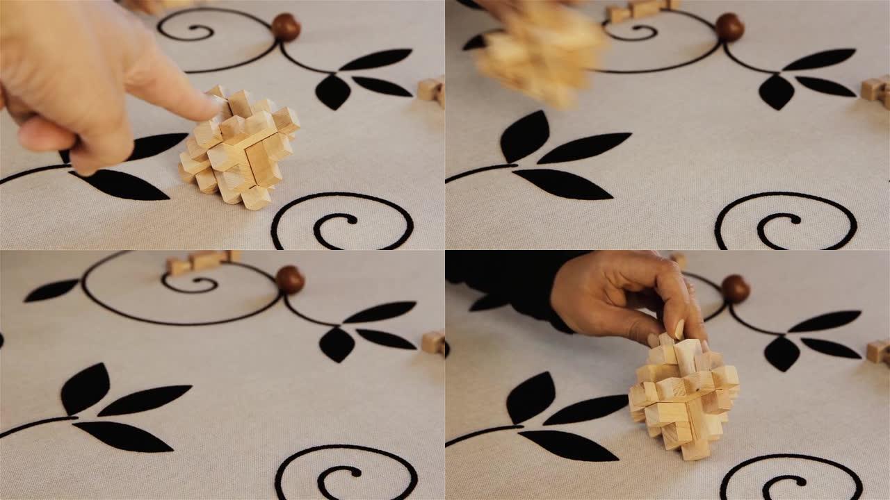 木制玩具块，两个男人的手捡起具有挑战性的拼图的木块。特写。