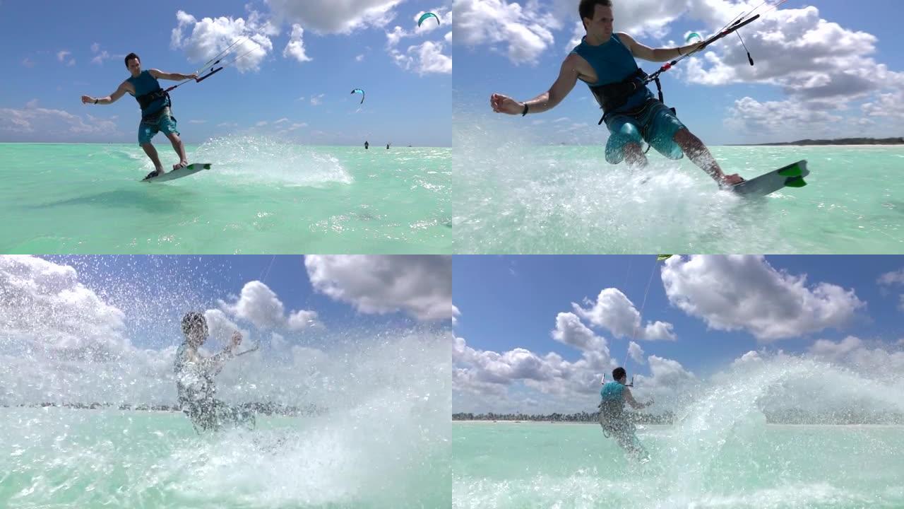特写: 在桑给巴尔冲浪的年轻风筝冲浪者跳了起来，并做了一个旋转技巧。