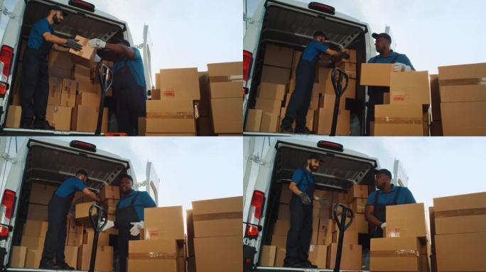 物流仓库两名快乐友好的笑工人使用手动托盘车开始装载送货卡车与纸箱，在线订单，采购，电子商务货物。慢动