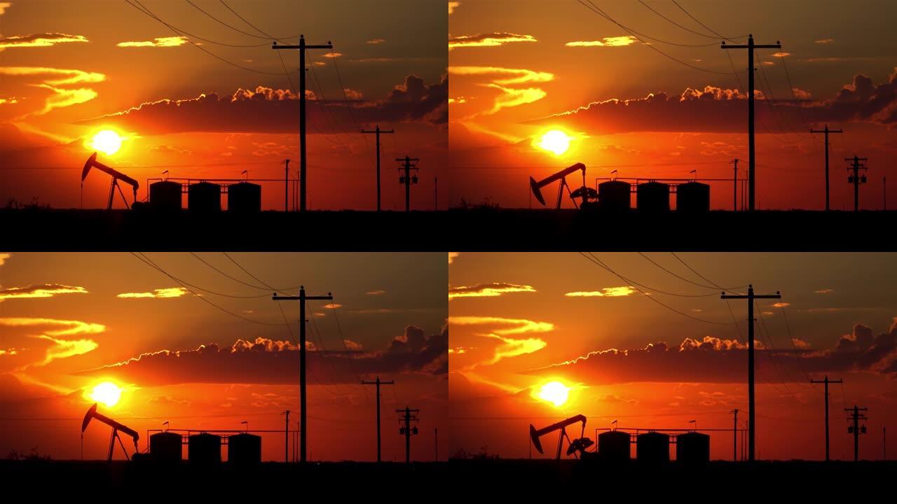 剪影: 杰克在日落时从奥斯汀的田野深处抽出化石燃料。