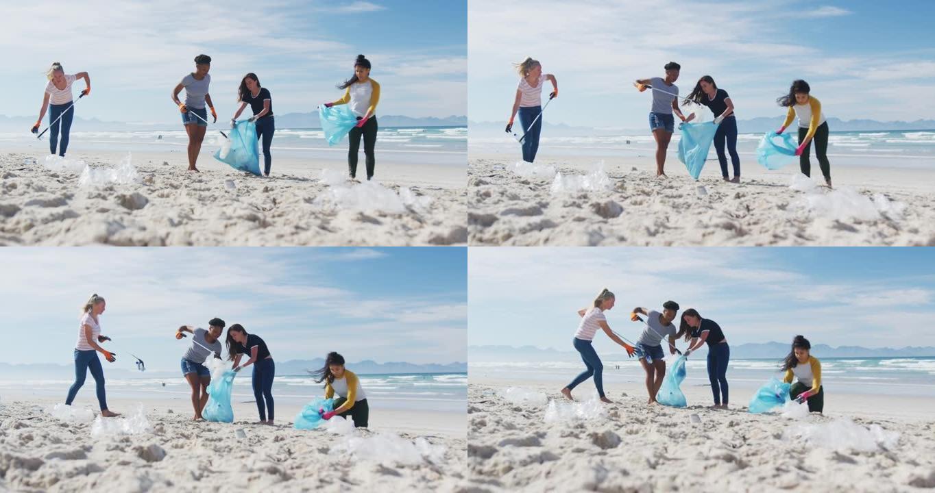 多样化的女性朋友将垃圾放在海滩上的垃圾袋中