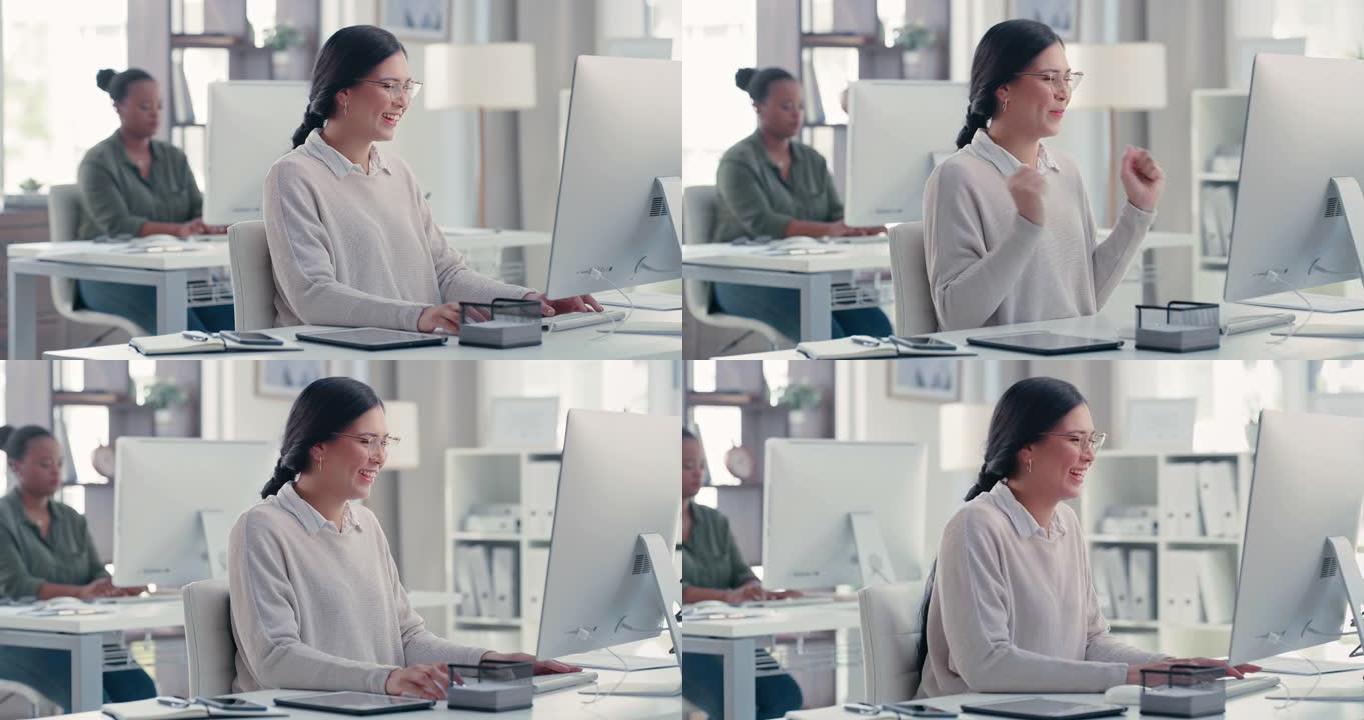 4k视频片段，一名年轻的女商人在办公室的计算机上工作时欢呼