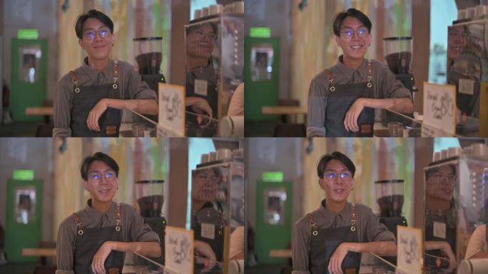 亚洲中国青少年咖啡馆咖啡师服务员看着相机微笑