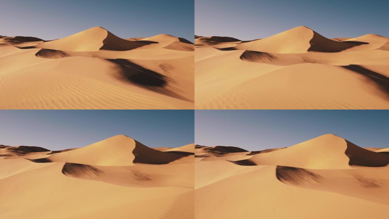 沙漠中沙丘的航拍。日落时飞越无尽的黄色沙丘