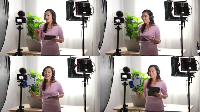 亚洲妇女在她的视频博客中与相机交谈，视频博客