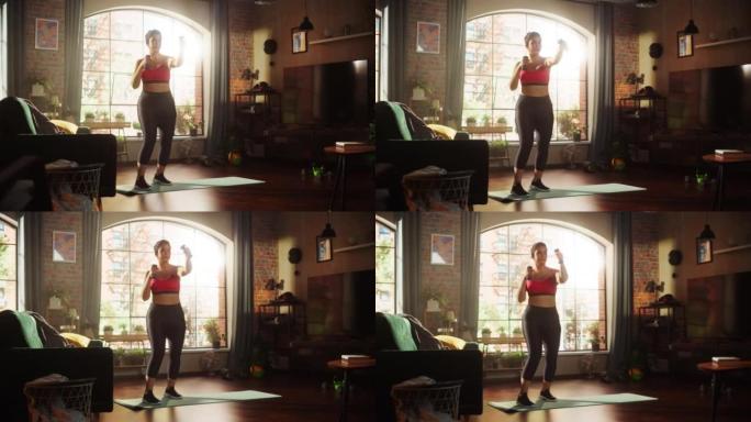 美丽的运动加身材积极的运动女人，做有氧运动锻炼，在家打太极拳。女性训练听音乐，戴着耳机播客。宽镜头