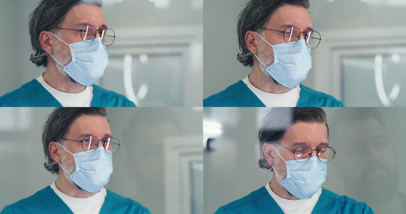 医疗中心接待时戴面具的成熟医生与病人交谈