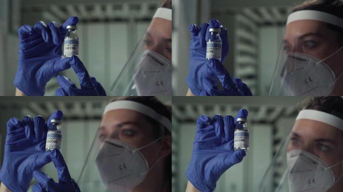 女医生或护士带着N95防护口罩和遮阳板在医院控制冠状病毒疫苗的电影微缩镜头。covid-19概念、医