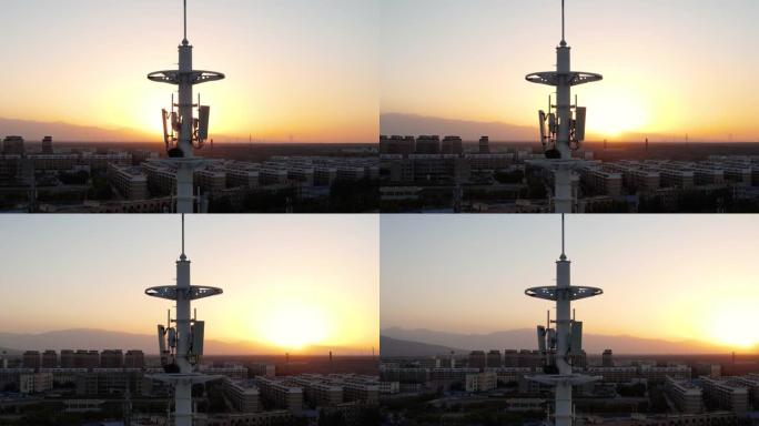 日落时5g蜂窝通信塔的鸟瞰图