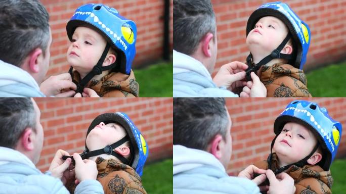 给我儿子戴上头盔儿子戴上头盔自行车