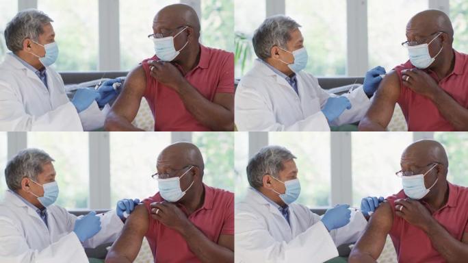 男医生戴口罩在家给非洲裔高级男子接种疫苗