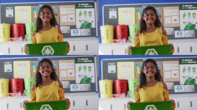 混血女学生微笑着，拿着回收箱，站在教室里