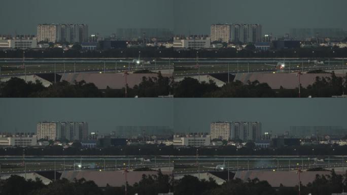 SLO MO大飞机在日落时分降落在跑道上，Donmueang国际机场