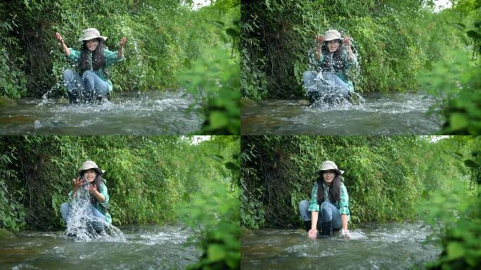 妇女在山间溪流中浇水