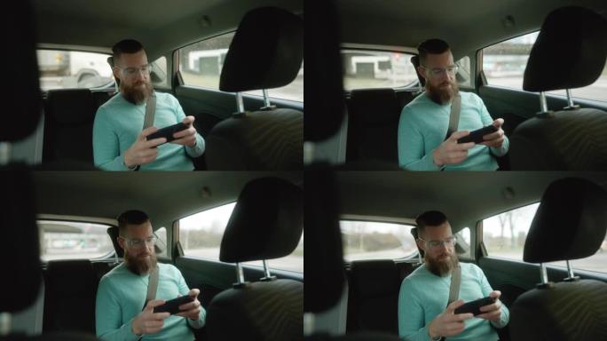 在车里玩手机游戏行车娱乐驾驶习惯防止分心