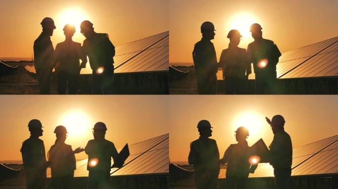 太阳能量学的工作人员正在日落时进行对话