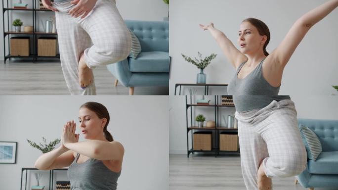 在公寓里做瑜伽的单腿平衡的未来母亲的慢动作