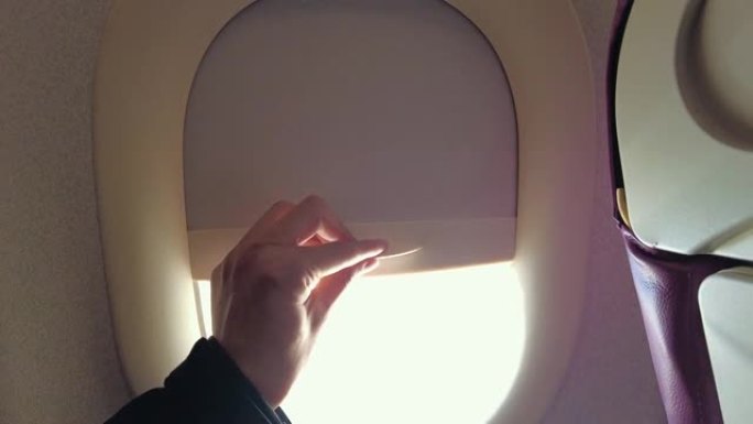 特写手打开飞机窗侧窗空镜视频素材