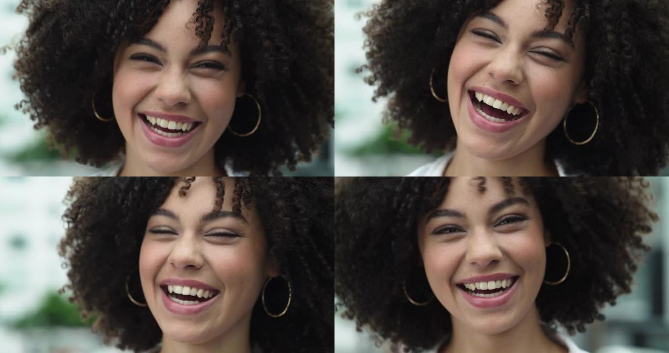 4k视频片段，一个美丽的年轻女子站在城市外面笑
