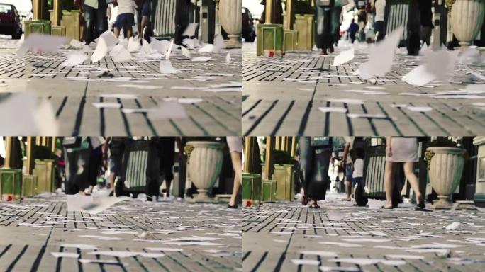 在阿根廷布宜诺斯艾利斯，五彩纸屑由从办公楼扔来的无用纸制成，以庆祝年底并象征着过去。地面视图。4k分
