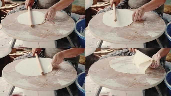 传统的土耳其当地食物，扁平面包lavash是由高级女性双手放在木板上制作的。