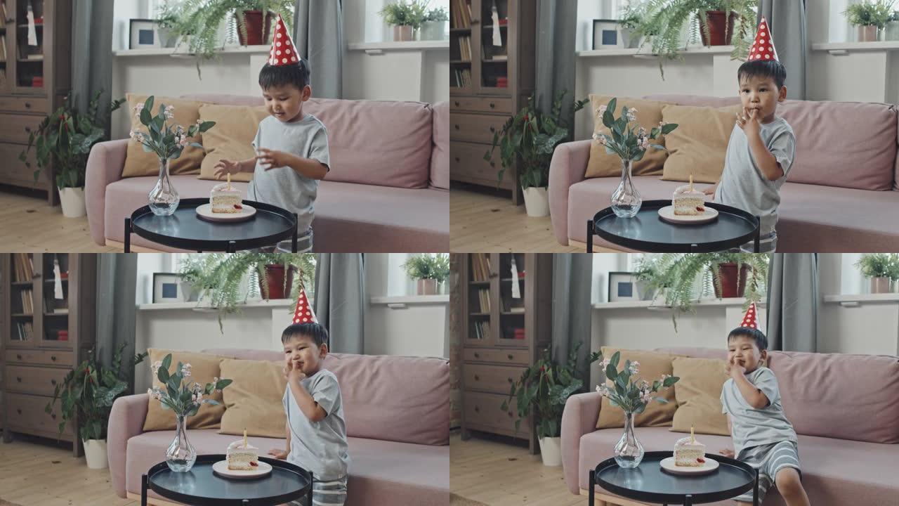 吃生日蛋糕的亚洲男孩