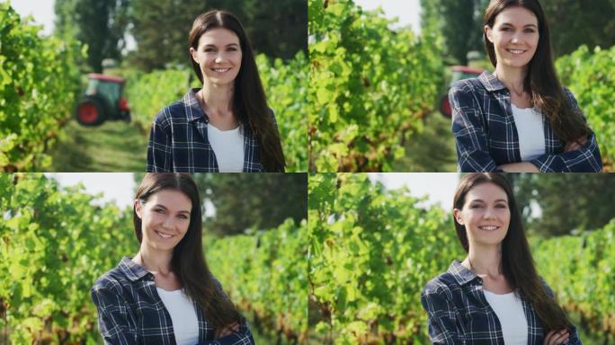 快乐的女农场主或酿酒师的真实镜头在葡萄园的镜头中微笑着，对葡萄收获的结果感到满意，以进一步生产高质量