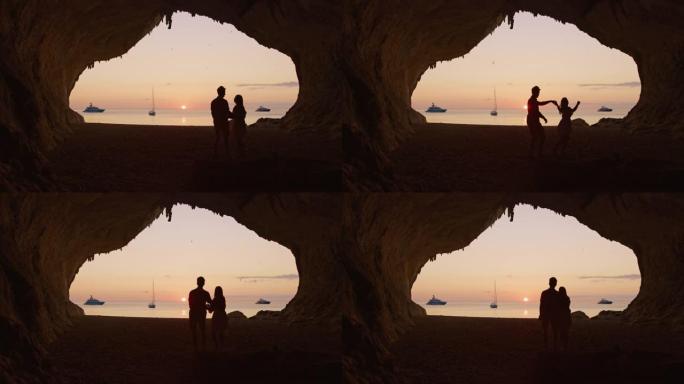 意大利撒丁岛卡拉卢纳海滩一对夫妇的慢动作视图。