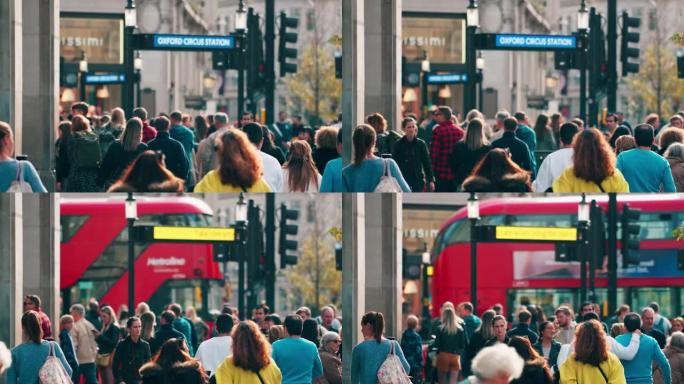 在伦敦市中心区牛津马戏街地区高峰时段，拥挤的通勤者行走的慢动作镜头