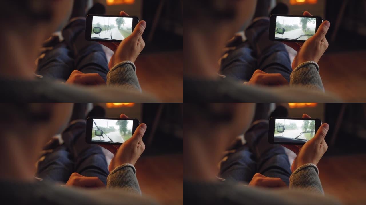 一名男子在家观看智能手机视频的4k视频片段