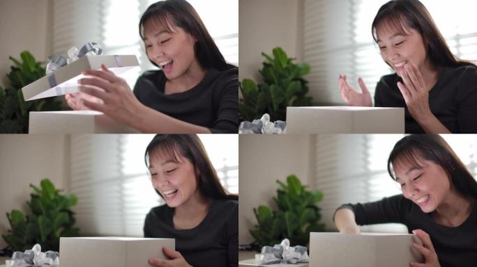 亚洲女性顾客打开包装箱