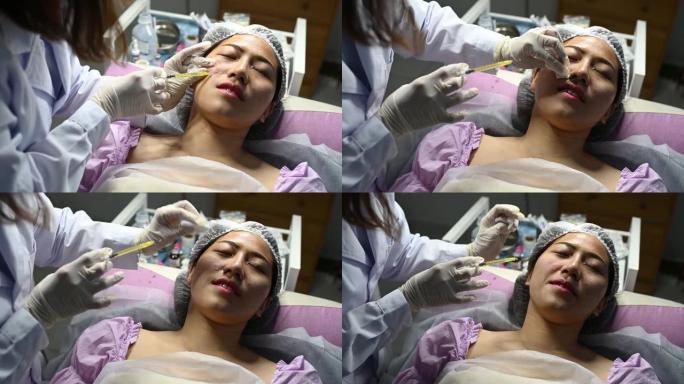 亚洲华人美容师在PRP吸血鬼整容期间向患者注射血浆。
