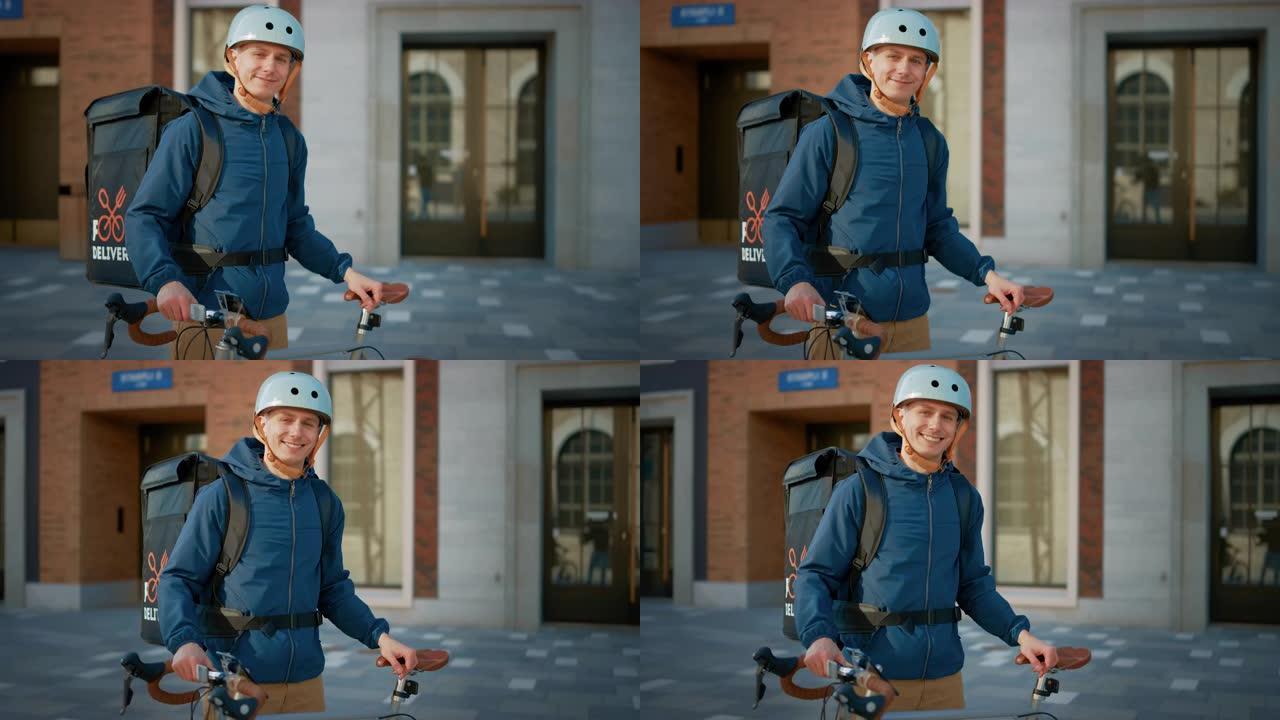 穿着保暖背包的英俊快乐送餐男子站在时尚现代市区的自行车旁边。微笑快递员的肖像安全地提供餐厅订单特写中