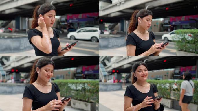 亚洲女性使用手机进行社交媒体。