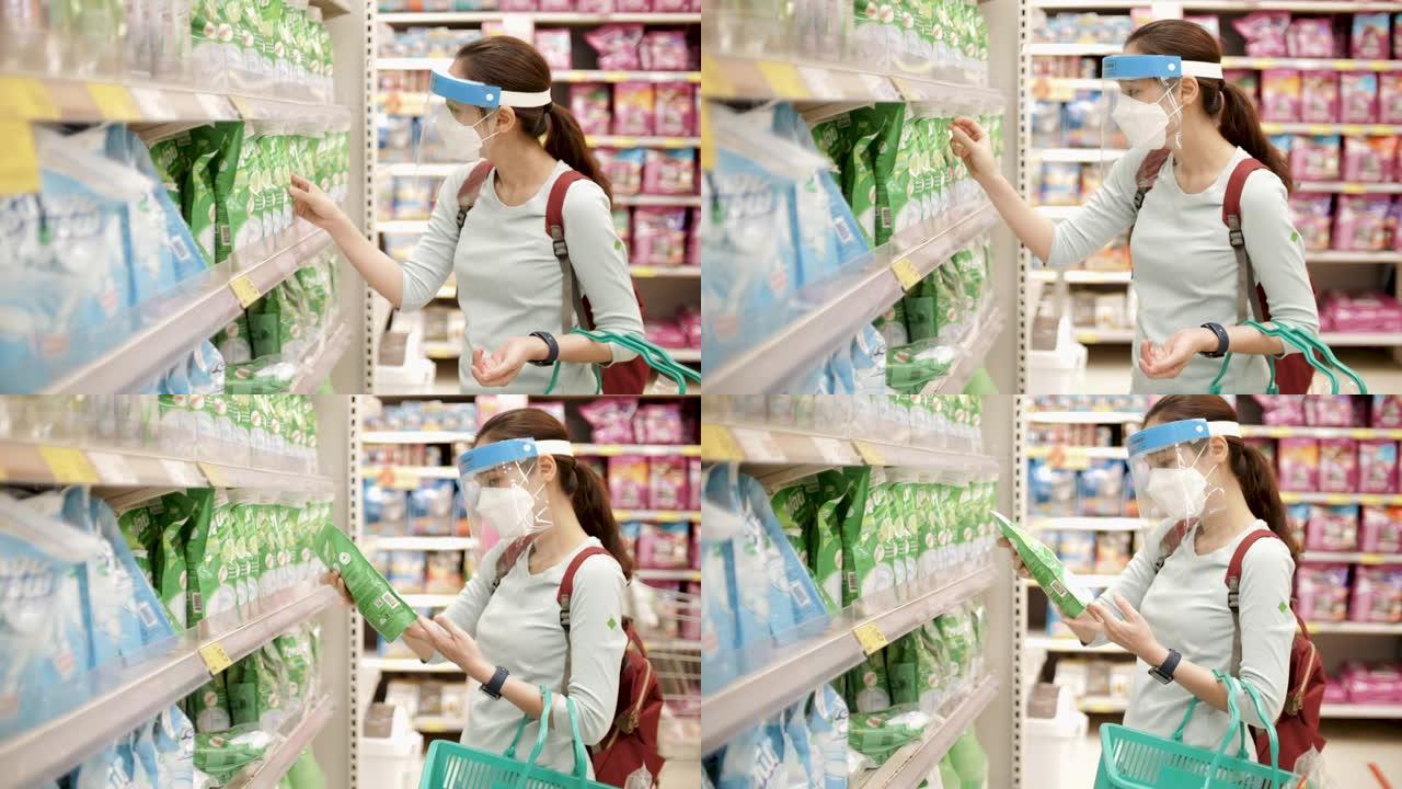 在超市戴口罩的亚洲妇女