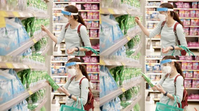 在超市戴口罩的亚洲妇女