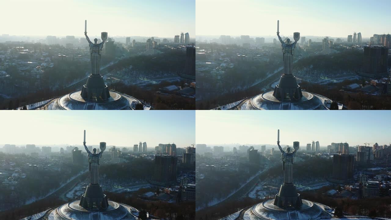 广角航拍著名的阳光明媚的冬天基辅自由地标雕像，祖国自由纪念碑在城市背景。