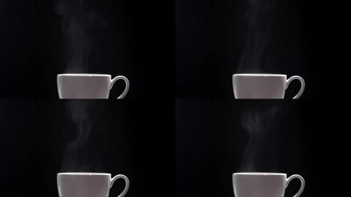 黑色背景上的热咖啡杯，特写