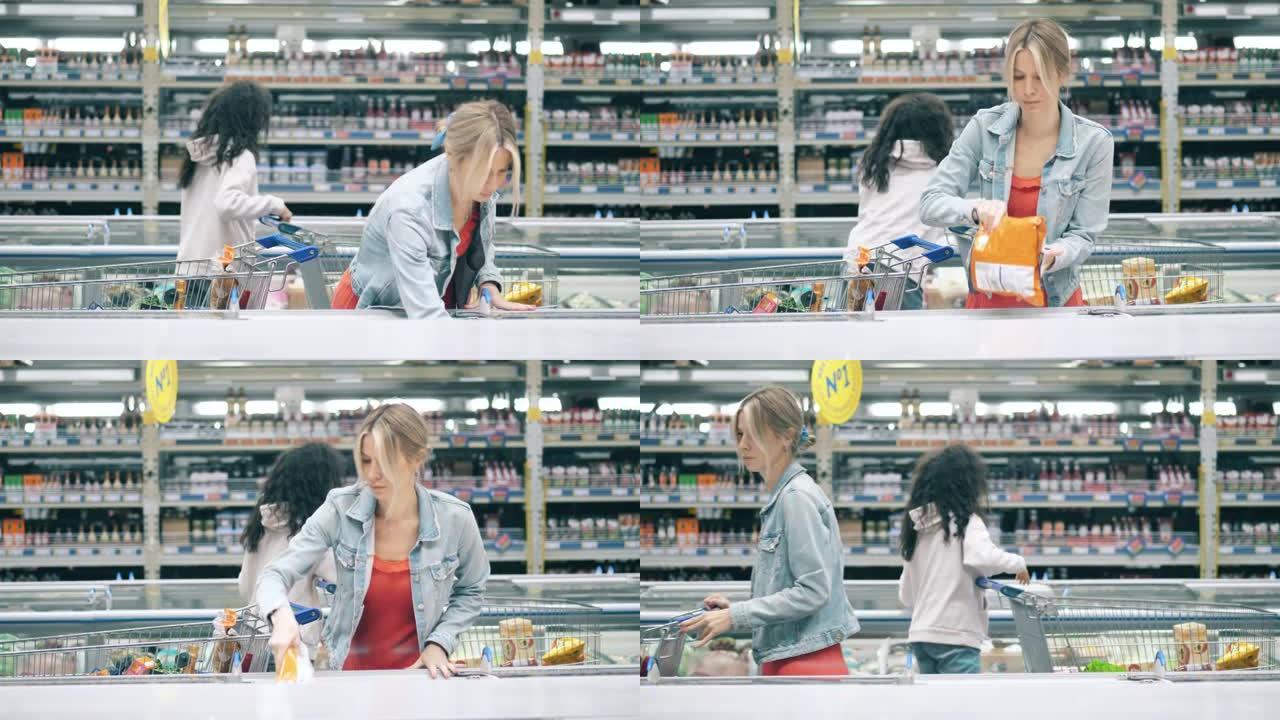 两名妇女在商店里捡冷冻产品