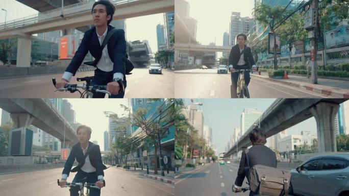 年轻的时髦男子在金融区骑自行车。