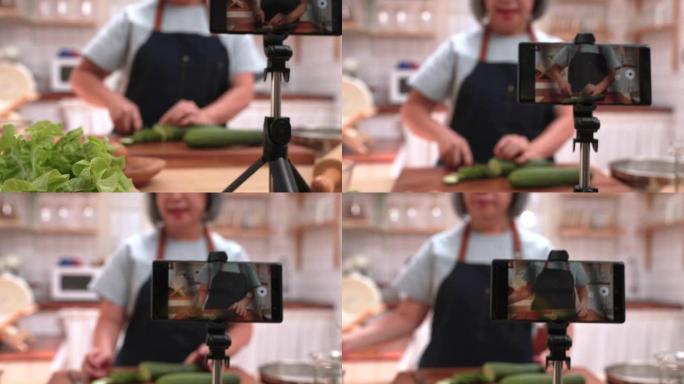 奶奶正在用手机教烹饪。又称vlogs，是区分老年人和现代科技的媒介。我们必须适应才能跟上。