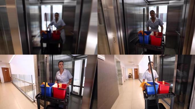 专业清洁工在医院将带清洁元件的手推车推下电梯