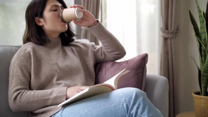 女人在家里放松时间看书喝咖啡