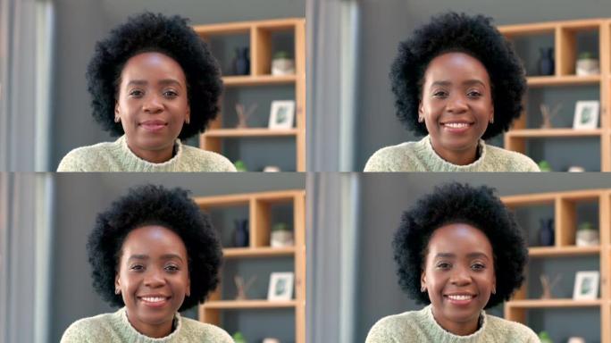 快乐的非洲女人在客厅里微笑的肖像。一位年轻女性的脸，在周末的早晨看起来很放松，很舒适，在舒适的冬天享