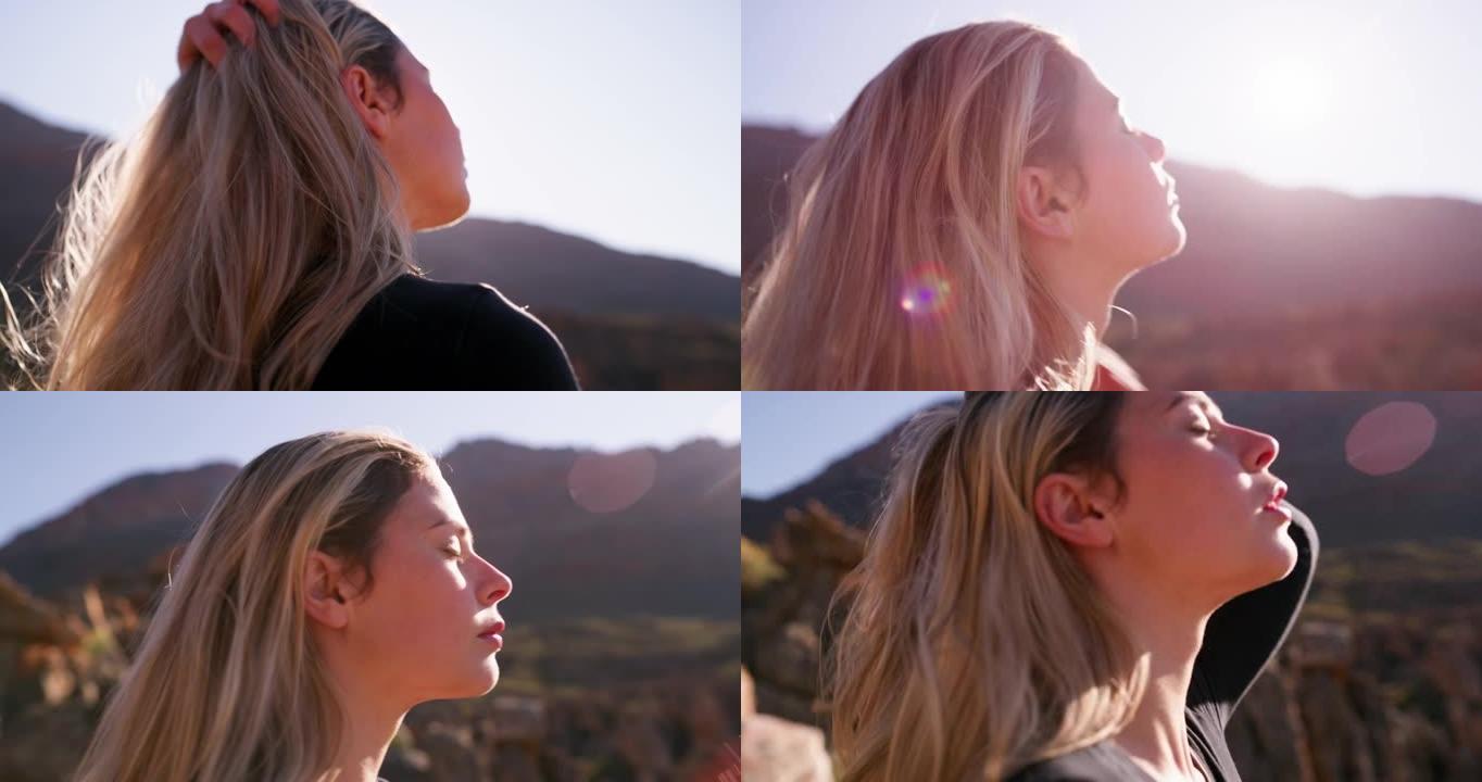 4k视频片段，一名年轻女子在山上沉思自然