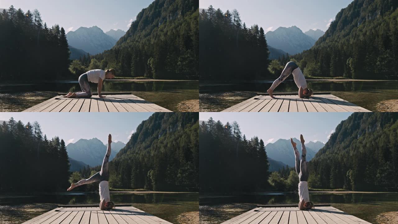 金发碧眼的女人在杰泽斯科湖前的木板路上做瑜伽体式