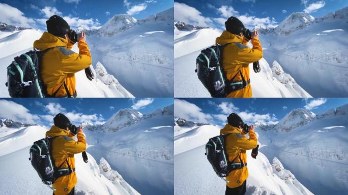 滑雪者在山顶上使用智能手机拍摄视频
